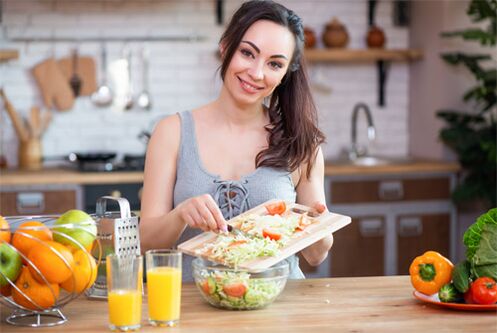 the girl prepares a meal for proper nutrition